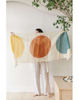 Cirq Moon Off White Multi Color Circle Pattern Hand Embroidered Linen Silk Handloom Scarf held by a model.