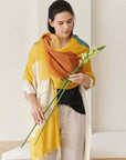 Cirq Sun Yellow Green Circle Pattern Hand Embroidered  Linen Silk Handloom Scarf worn with a flower.
