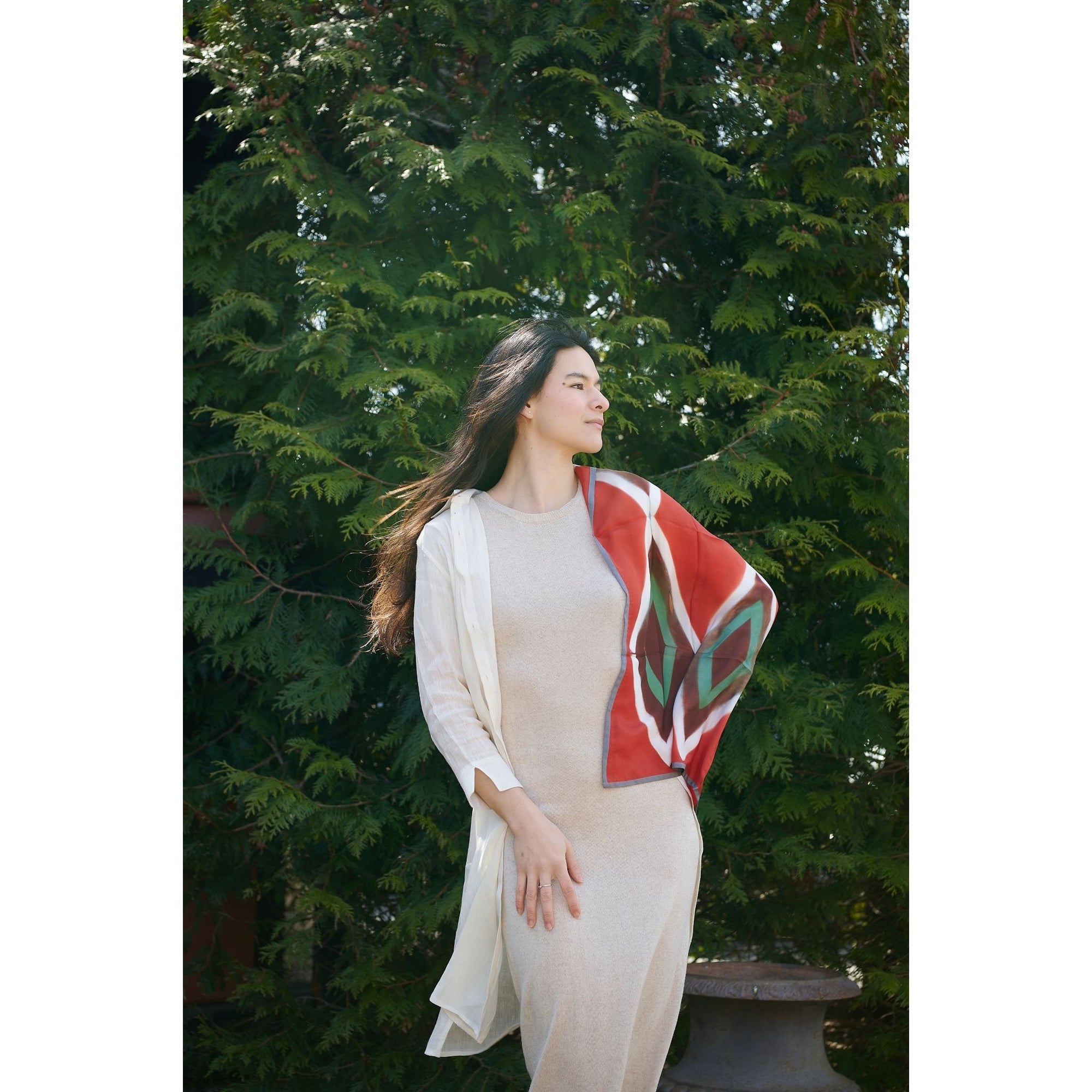 Fawn Square Silk Artisanal Scarf In Multicolor Hand Crafted Shibori Print styled elegantly outdoors.