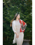 Fawn Square Silk Artisanal Scarf In Multicolor Hand Crafted Shibori Print styled elegantly outdoors.