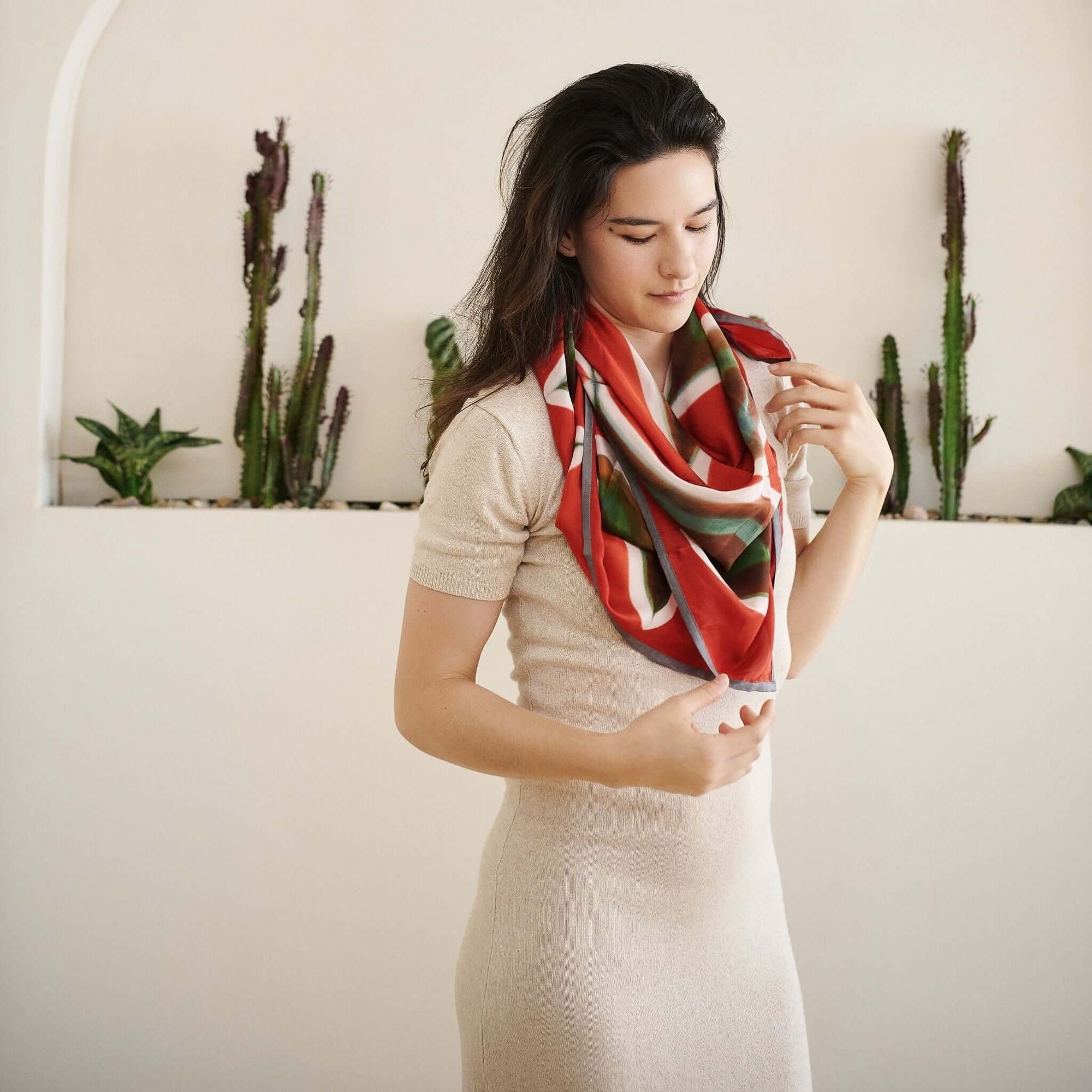 Fawn Square Silk Artisanal Scarf In Multicolor Hand Crafted Shibori Print styled elegantly around a model's neck.