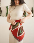 Fawn Square Silk Artisanal Scarf In Multicolor Hand Crafted Shibori Print styled around the waist by a model.