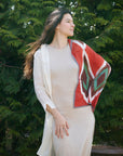 Fawn Square Silk Artisanal Scarf In Multicolor Hand Crafted Shibori Print draped elegantly on a model outside.