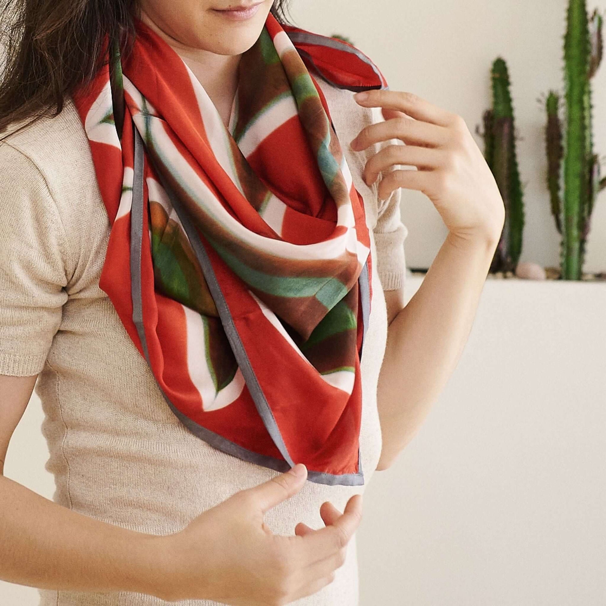 Fawn Square Silk Artisanal Scarf In Multicolor Hand Crafted Shibori Print styled elegantly around the neck.