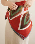 Fawn Square Silk Artisanal Scarf In Multicolor Hand Crafted Shibori Print styled and tied on a model.