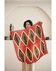 Fawn Square Silk Artisanal Scarf In Multicolor Hand Crafted Shibori Print displayed by a model.