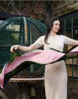 Iris Kiwi Green Pink Cashmere Merino Handwoven Scarf being elegantly displayed outdoors.