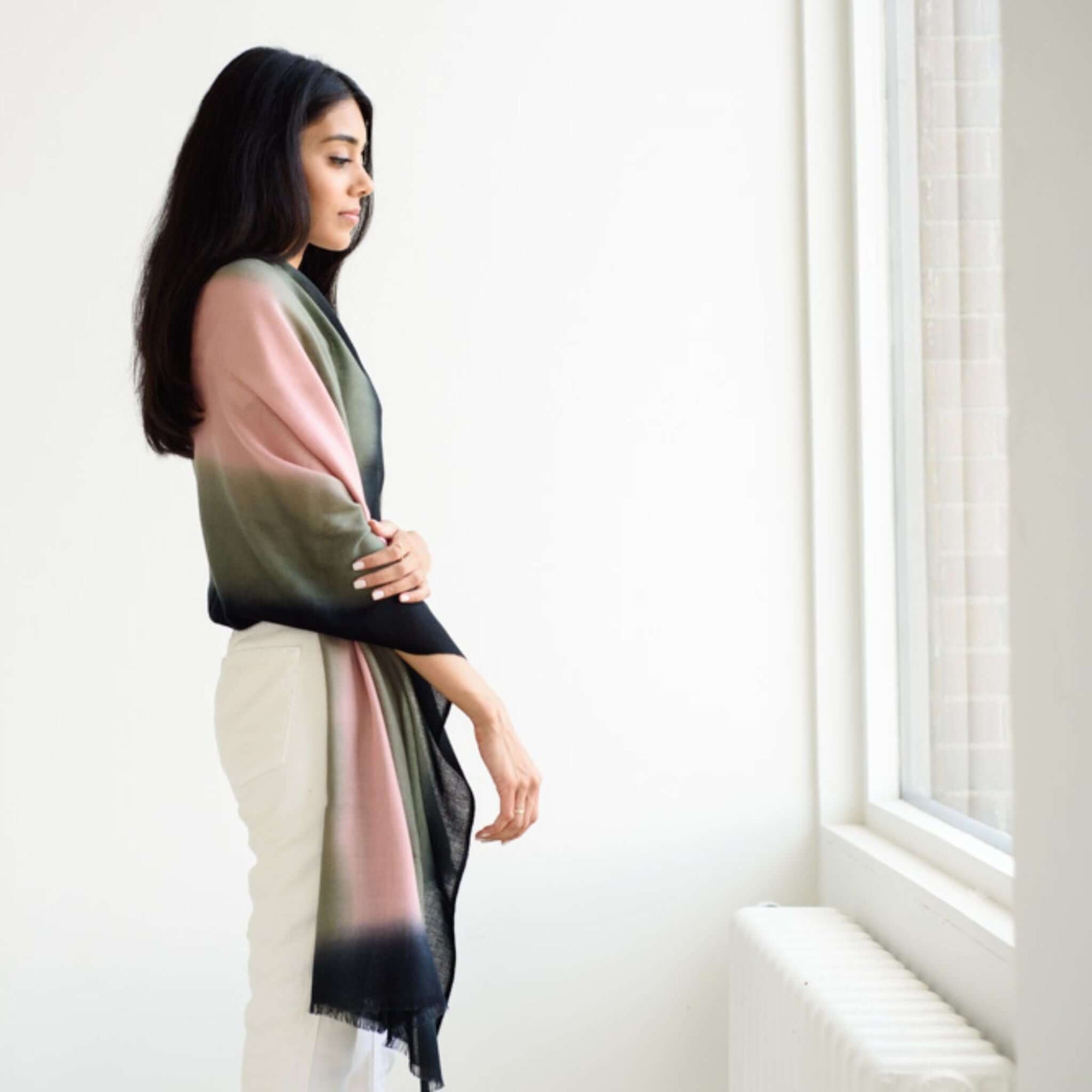 Iris Kiwi Green Pink Cashmere Merino Handwoven Scarf draped elegantly by a model, showcasing its unique colors and craftsmanship.