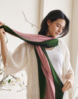 Iris Kiwi Green Pink Cashmere Merino Handwoven Scarf draped elegantly, showcasing vibrant colors and luxurious texture.