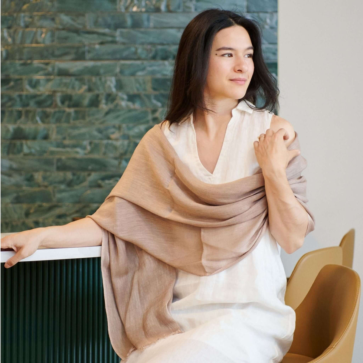 Jute Golden Brown Hand Woven Soft Linen Silk Scarf draped elegantly on a model in a modern setting.
