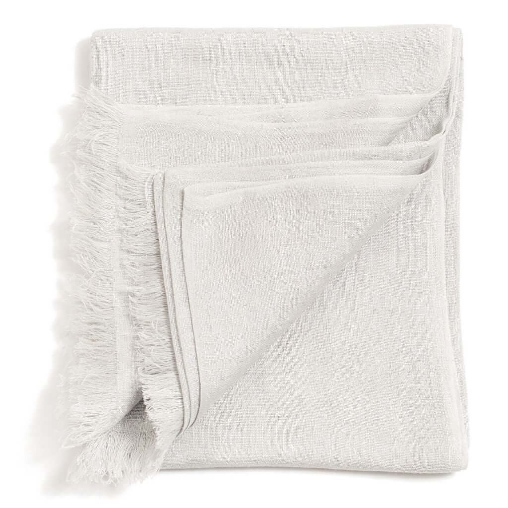 Jute Golden Brown Hand Woven Soft Linen Silk Scarf in pebble color, showcasing soft, breathable fabric with fringed edges.