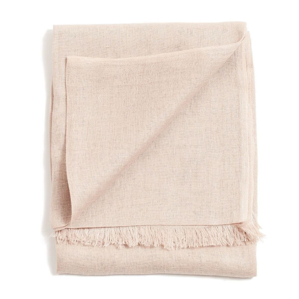 Jute Golden Brown Hand Woven Soft Linen Silk Scarf folded, showcasing its elegant and translucent appeal in a soft oat color.