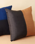 Kala Black & Gold Color Block Mulberry Silk Square Pillow showcasing luxurious silk texture.
