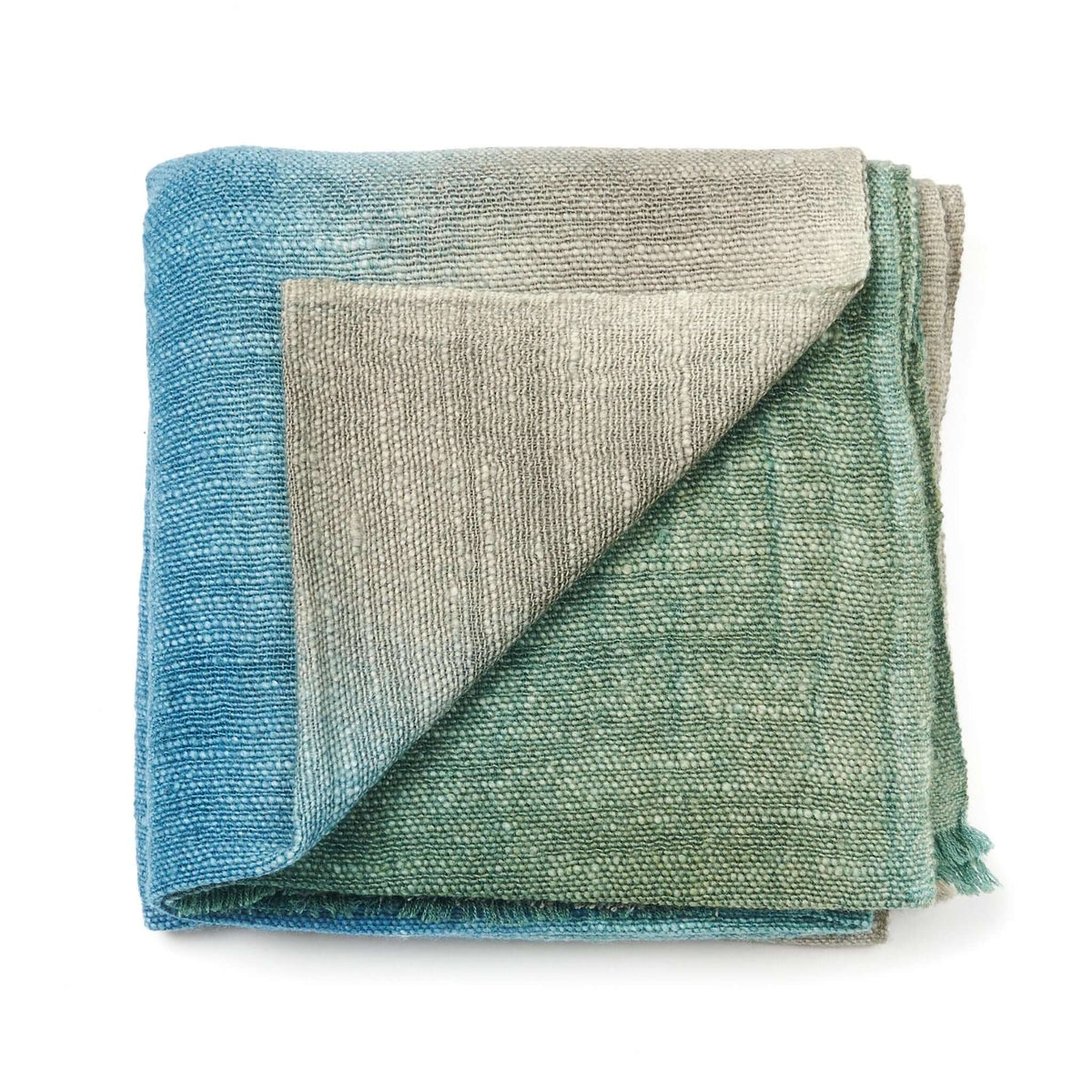 Lake Moss Handwoven Merino Throw Blanket in serene shades of blue and green, showcasing artisanal handwoven craftsmanship.