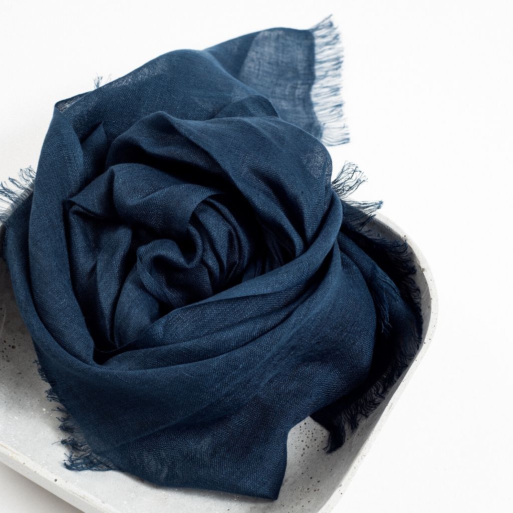 Midnight Navy Blue Hand Woven Linen Silk Blend Scarf elegantly displayed in a neutral tray, showcasing its soft texture.