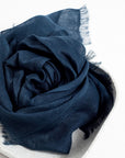 Midnight Navy Blue Hand Woven Linen Silk Blend Scarf elegantly displayed in a neutral tray, showcasing its soft texture.
