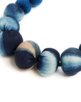 Mihika silk beaded necklace featuring handcrafted silk beads in shades of blue and natural variations.