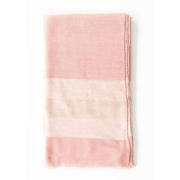 Rosa Plush Maroon Plush Merino Queen Bedspread / Large Throw draped on a surface showcasing its soft pink hues and luxurious texture.
