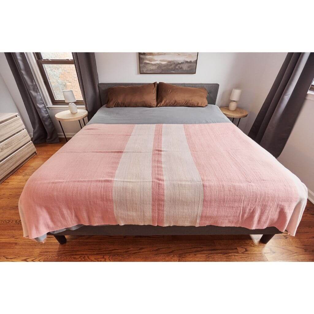 Rosa Plush Maroon Plush Merino Queen Bedspread / Large Throw displayed on a bed, featuring modern design and soft colors.