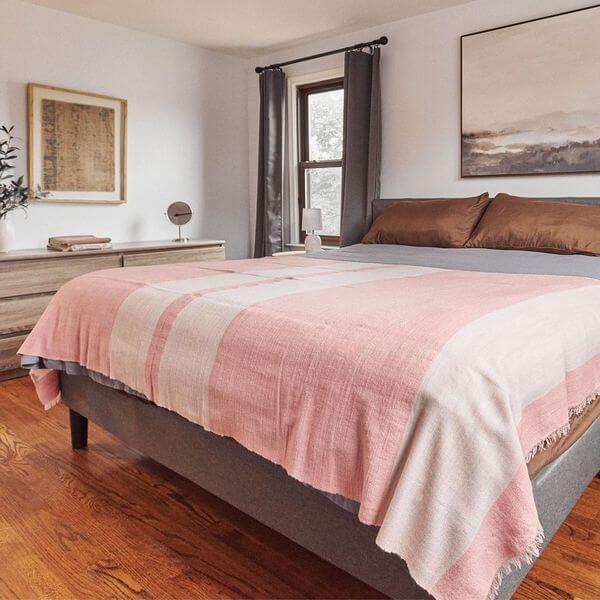 Rosa Plush Maroon Plush Merino Queen Bedspread / Large Throw draped over a bed in a modern bedroom setting.