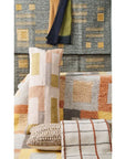 Shale Hand Woven Pastel Color Large Geometric Lumbar Pillow displayed among colorful decor and textiles.