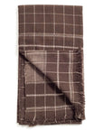 Treacle Checks Pattern Organic Cotton Handloom Throw showcasing a luxurious brown check design with fringed edges.