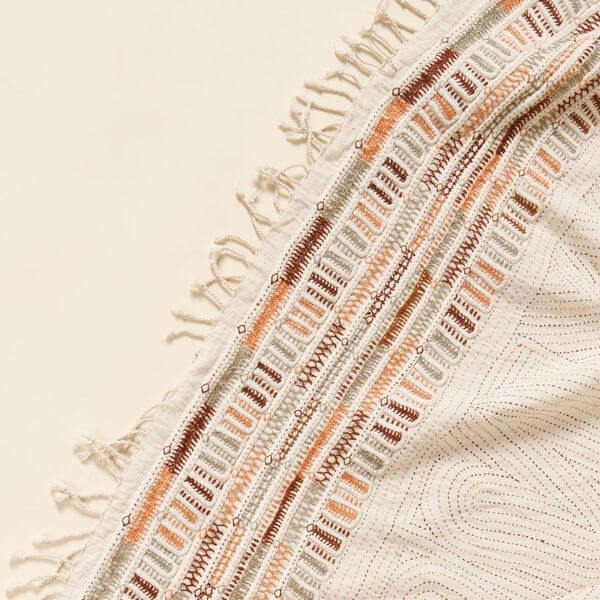 Unah Coral Hand Embroidered Handwoven Cotton Artisan Throw with colorful borders and intricate fringe detail.